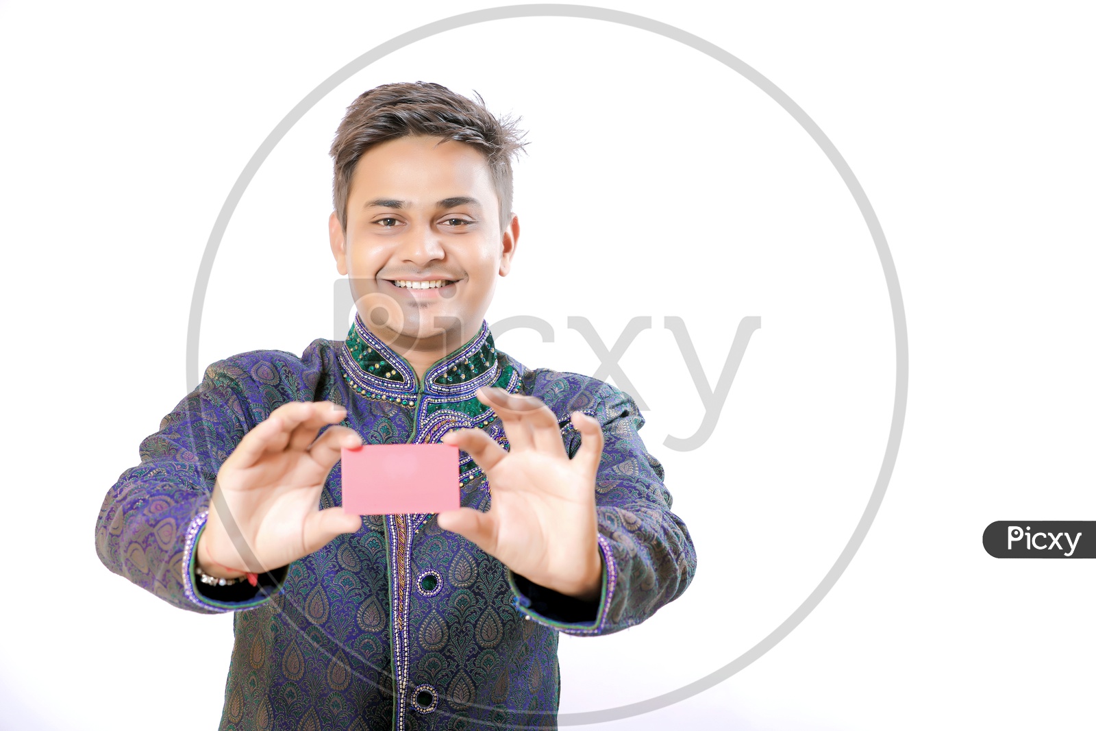 Indian Man Holding a Visiting Card in Hand And showing to Camera On an Isolated White Background