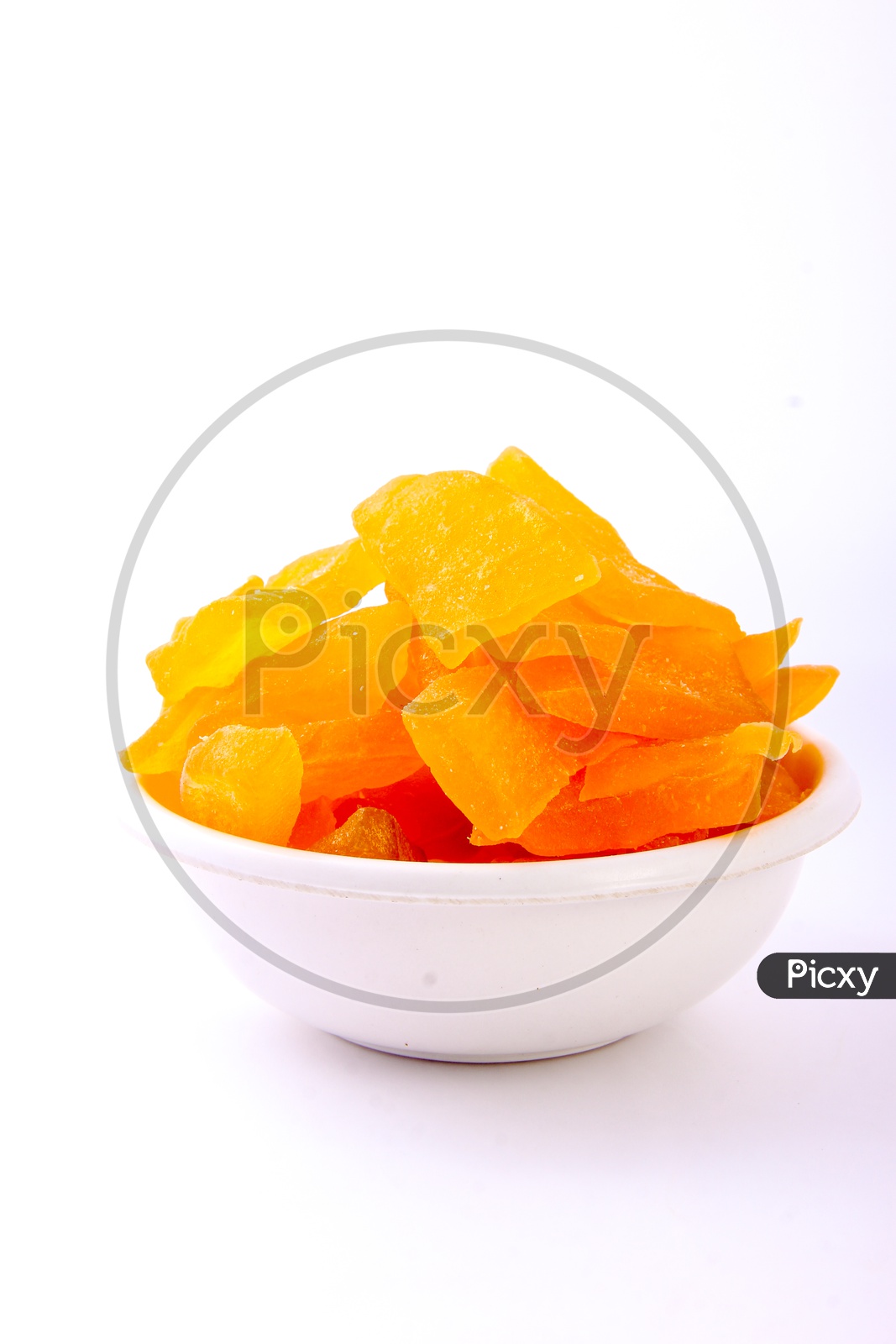 Image of Dried Mango Slices In a Bowl On an Isolated White Back Ground