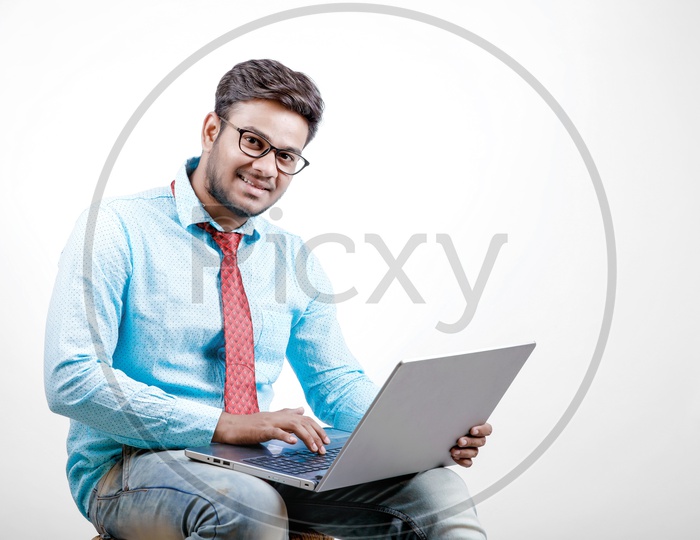 Young Indian Student/Businessman with Laptop