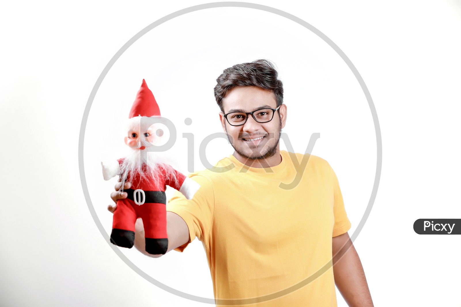 Young Indian Man with Santa Claus  and white background.