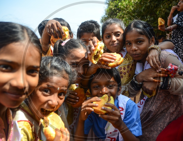 Children pose for a photograph during National Child Labour Project program