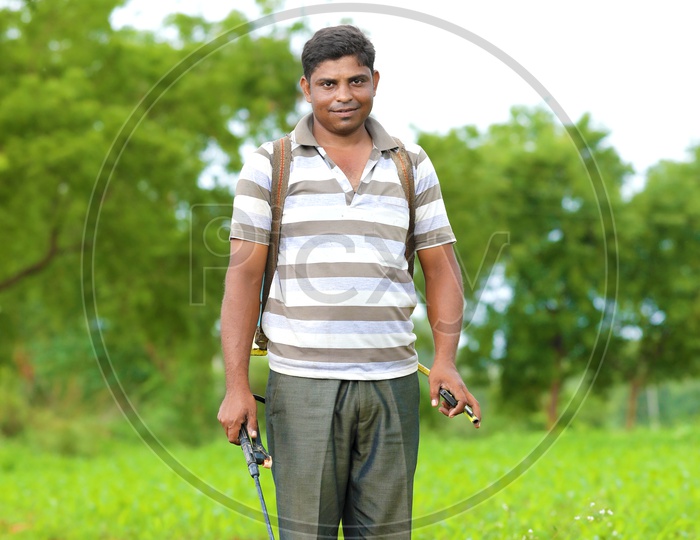 Farmer Spraying Pesticide at Agriculture Fields with smiling face