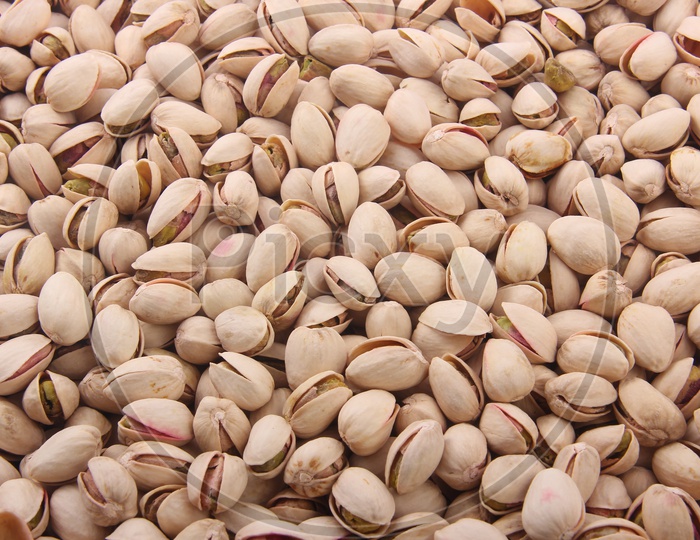 Fresh Pistachio Nuts Forming a Background and Showing the  Texture