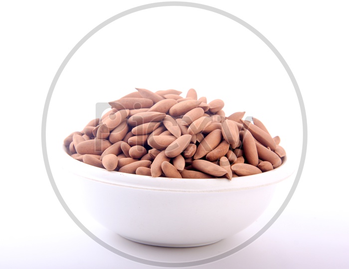 Pine Nuts In a Bowl On an Isolated White Background