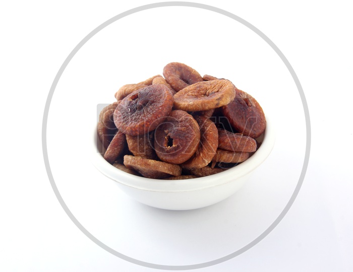 Dried Fig or Anjeera  in a Bowl on an Isolated White Background