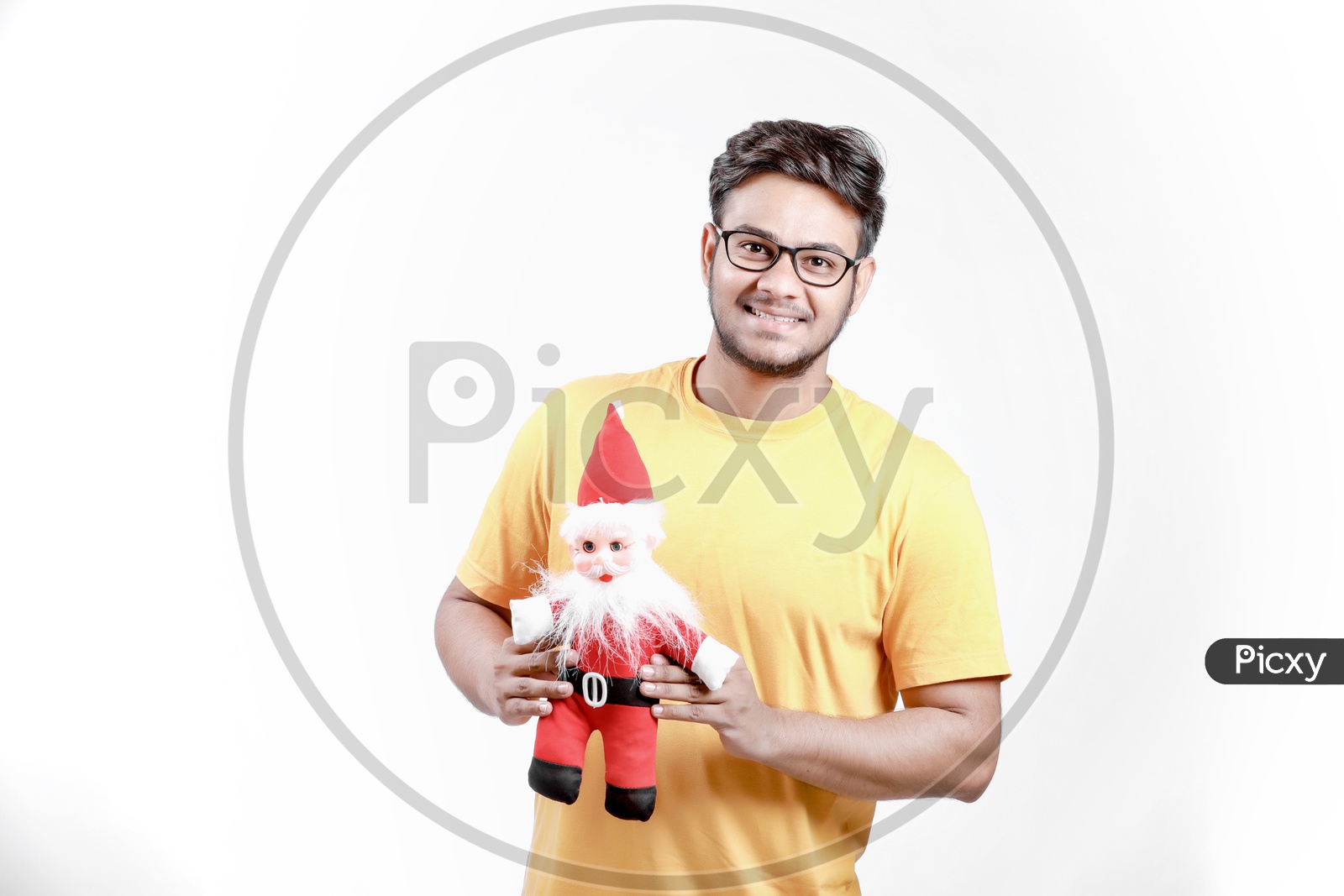 Young Indian Man with Santa Claus and white background.