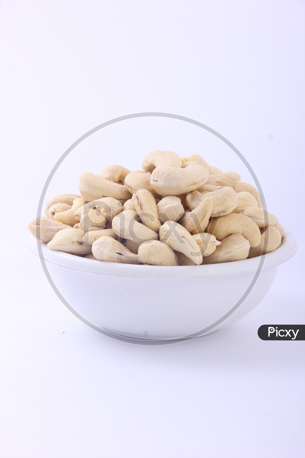 Image of Bowl of Cashews / Cashews in a Bowl isolated on a White ...