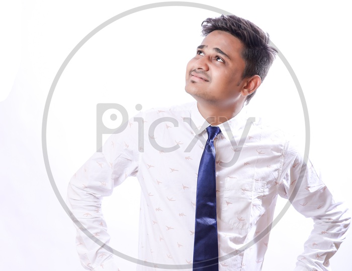 Portrait Of A Confident Youngman in Formalwear  With Expression and looking to Space With White  Background