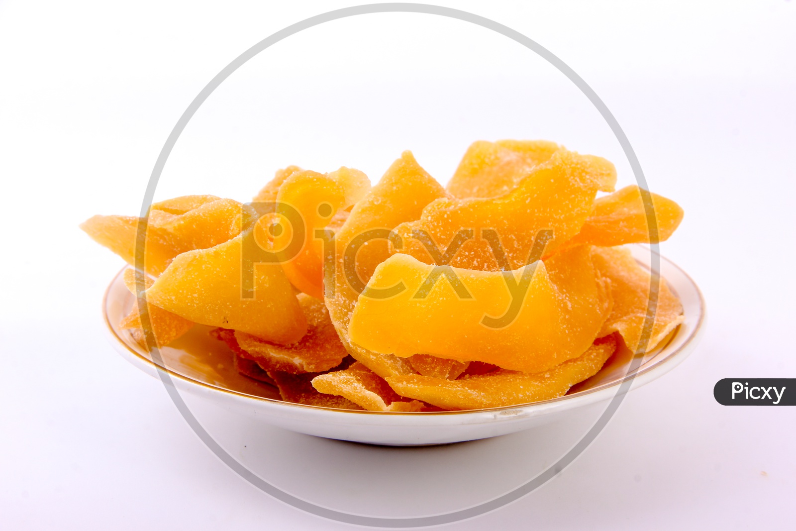Dried Mango Slices In a Bowl On an Isolated White Back Ground
