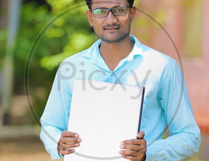 Indian Male Model showing Blank Poster