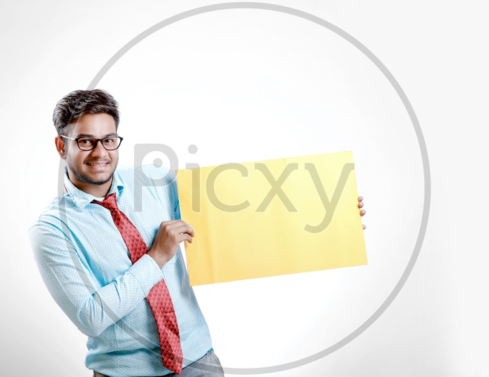 Indian  Model in Formalwear Showing Empty  Placard with Expression on an Isolated White Background