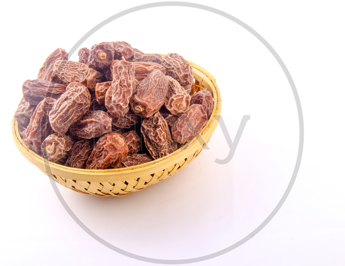 Dry Dates in Bowl Isolated in White Background
