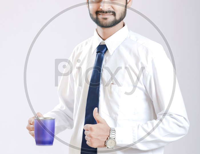 Young Indian Man Holding Cup in Hand