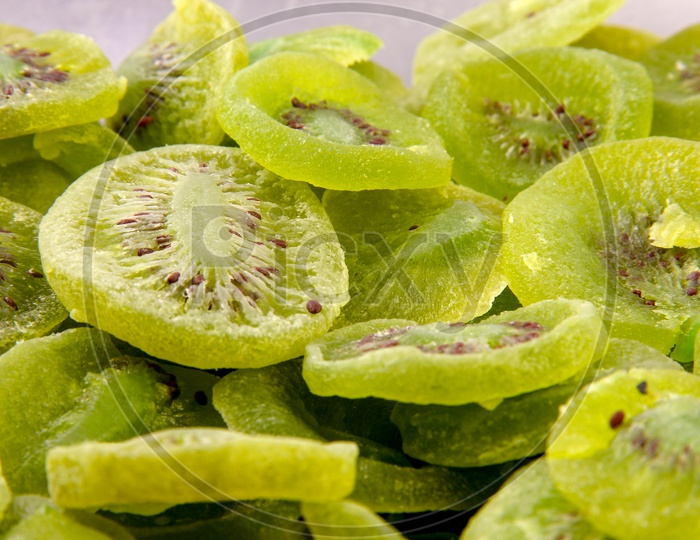Dried Kiwis Composition Shot Forming a Background