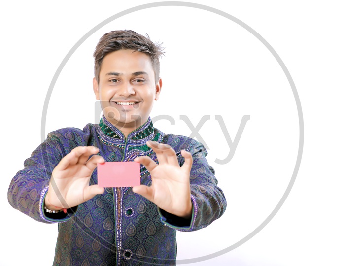 Indian Man Holding a Visiting Card in Hand And showing to Camera On an Isolated White Background