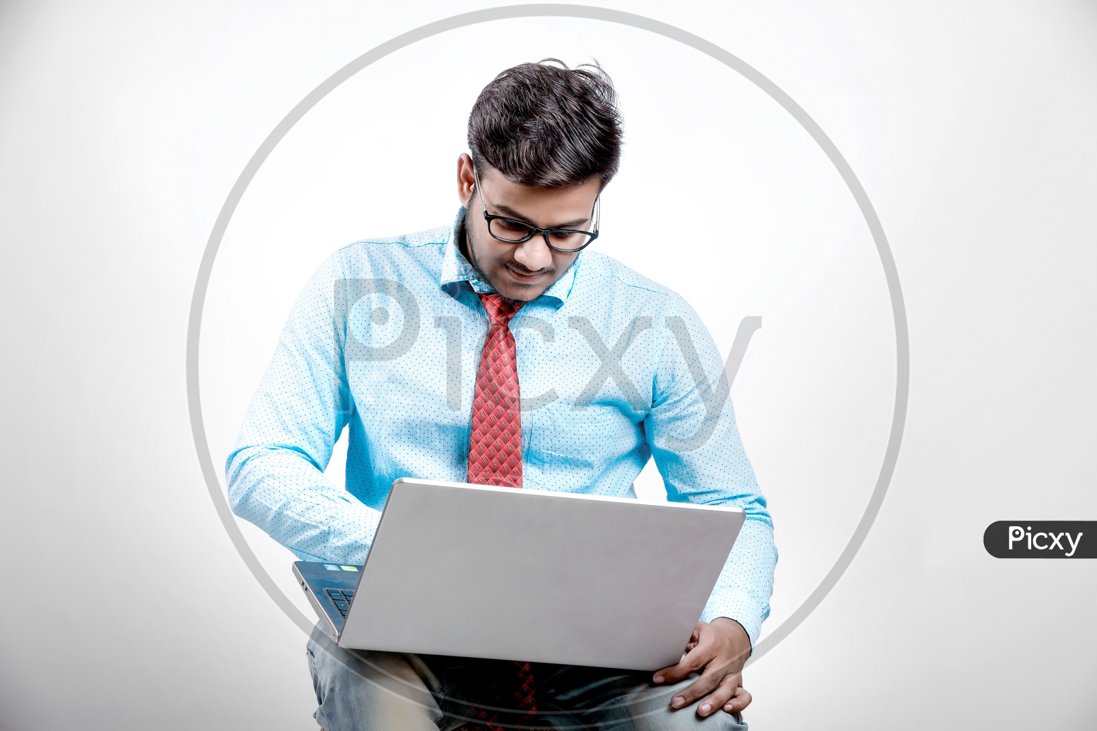 Young Indian Businessman with Laptop