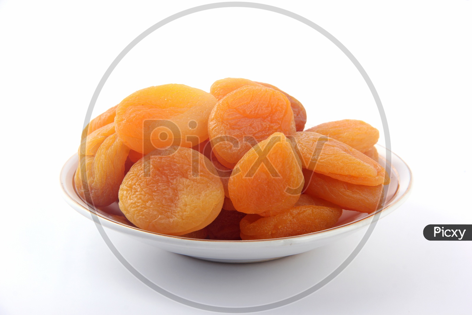 Dried Apricots  in a Bowl on a Isolated White Background
