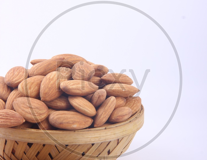Almonds in Bowl on a Isolated White Background
