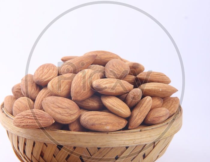 Almonds in Bowl on a Isolated White Background
