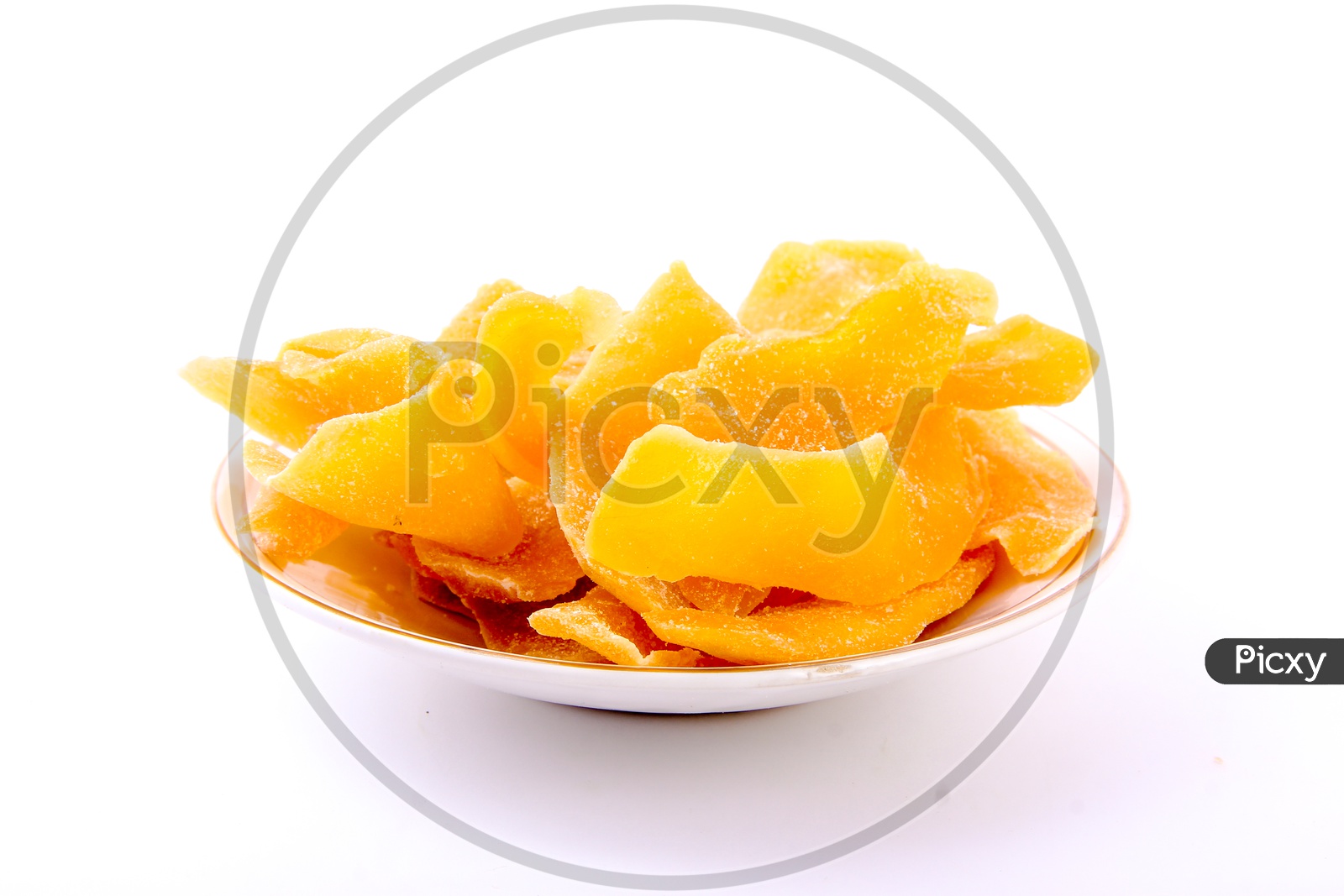 Dried Mango Slices in  a Bowl on an Isolated White Background