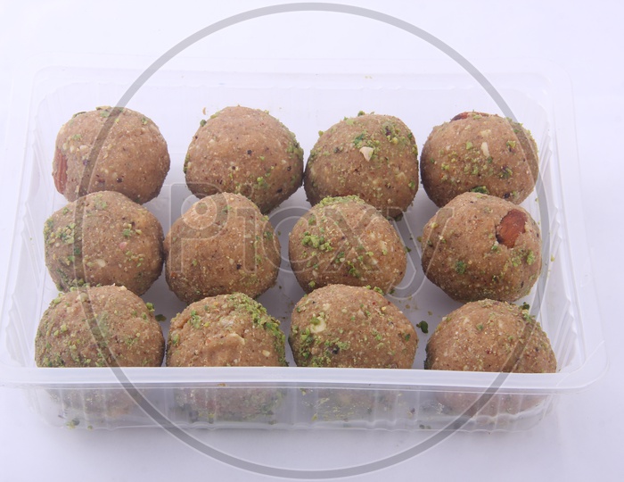Laddu in a bowl with  White background  / Ladoo