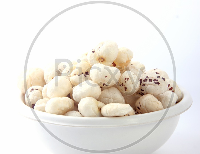 Fox Nuts / Gorgon Nuts /Makhana / Lotus Seed Pops in a Bowl on an Isolated White Background