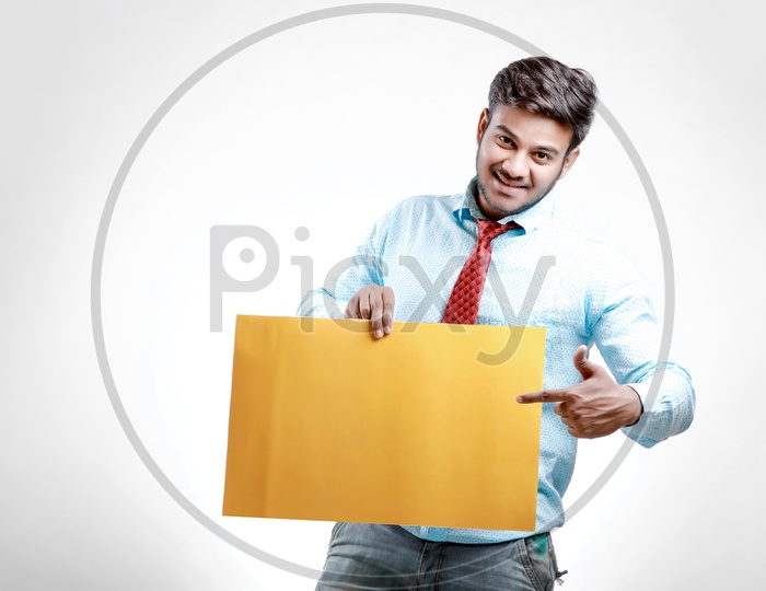 Indian  Model in Formalwear Showing Empty  Placard on an Isolated White Background