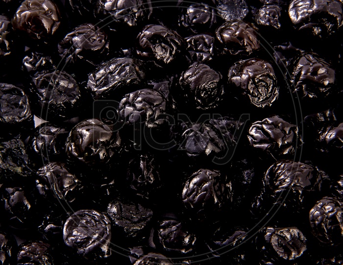 Dried Prunes / Plums Composition Shot Forming a Bakground