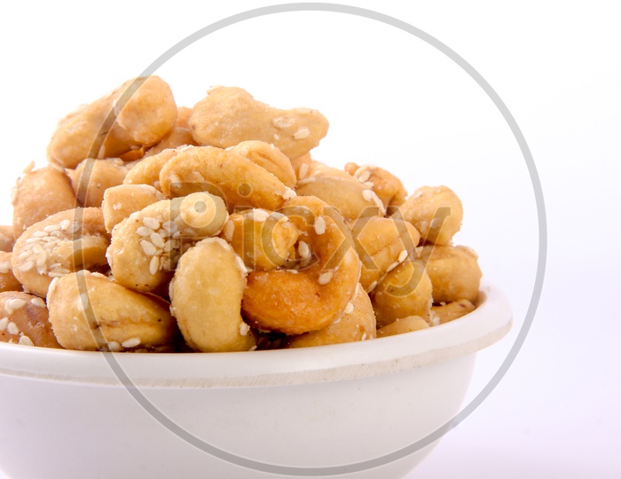 Sugar Sesame Cashew in Bowl Isolated in White Background