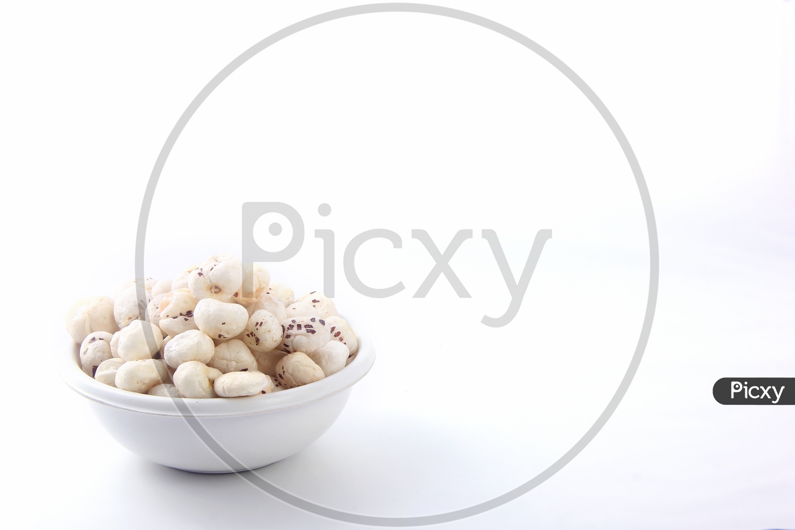Fox Nuts / Gorgon Nuts /Makhana / Lotus Seed Pops in a Bowl on an Isolated White Background