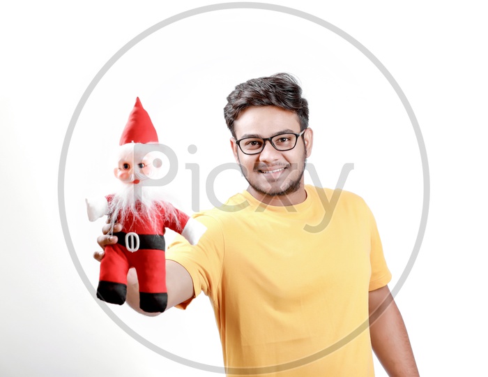 Young Indian Man with Santa Claus  and white background.