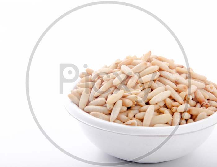 Pine Nuts In a Bowl On an Isolated White Background