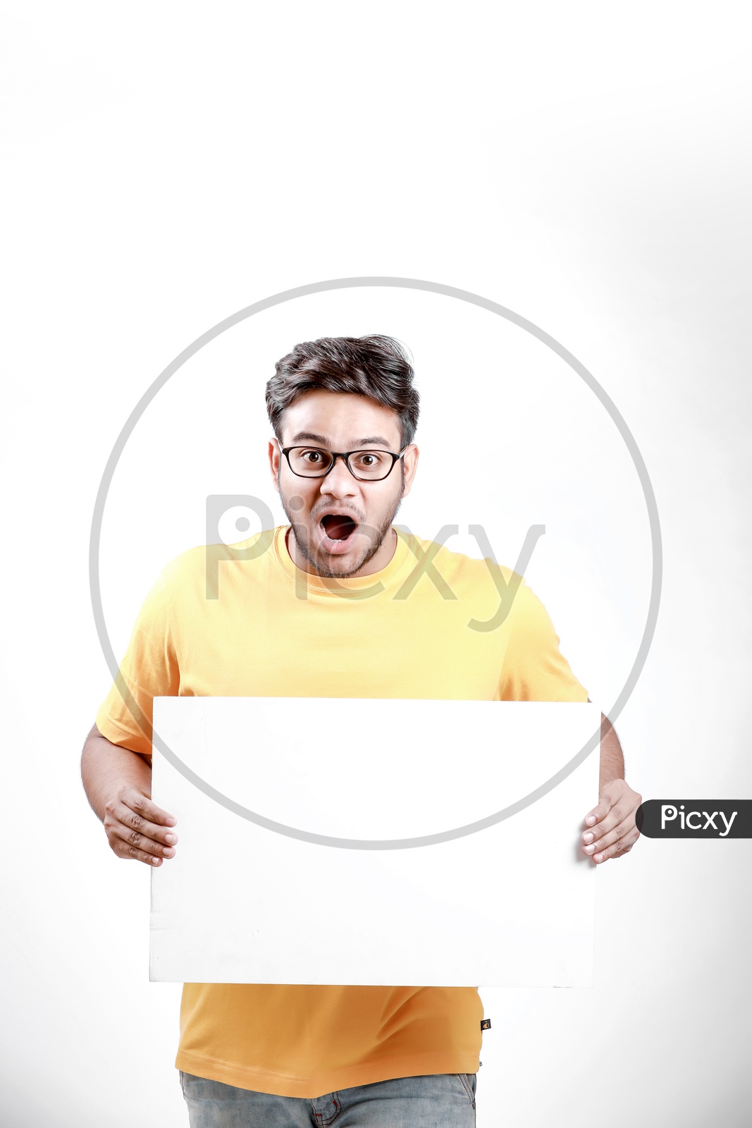 Young Indian Model Showing Blank Poster with surprising face.