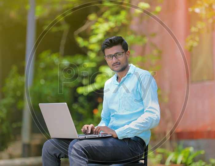 Indian College Student using Laptop