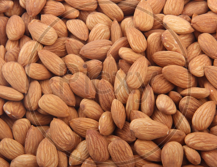 Background of a Big Raw Almonds Situated Arbitrarily