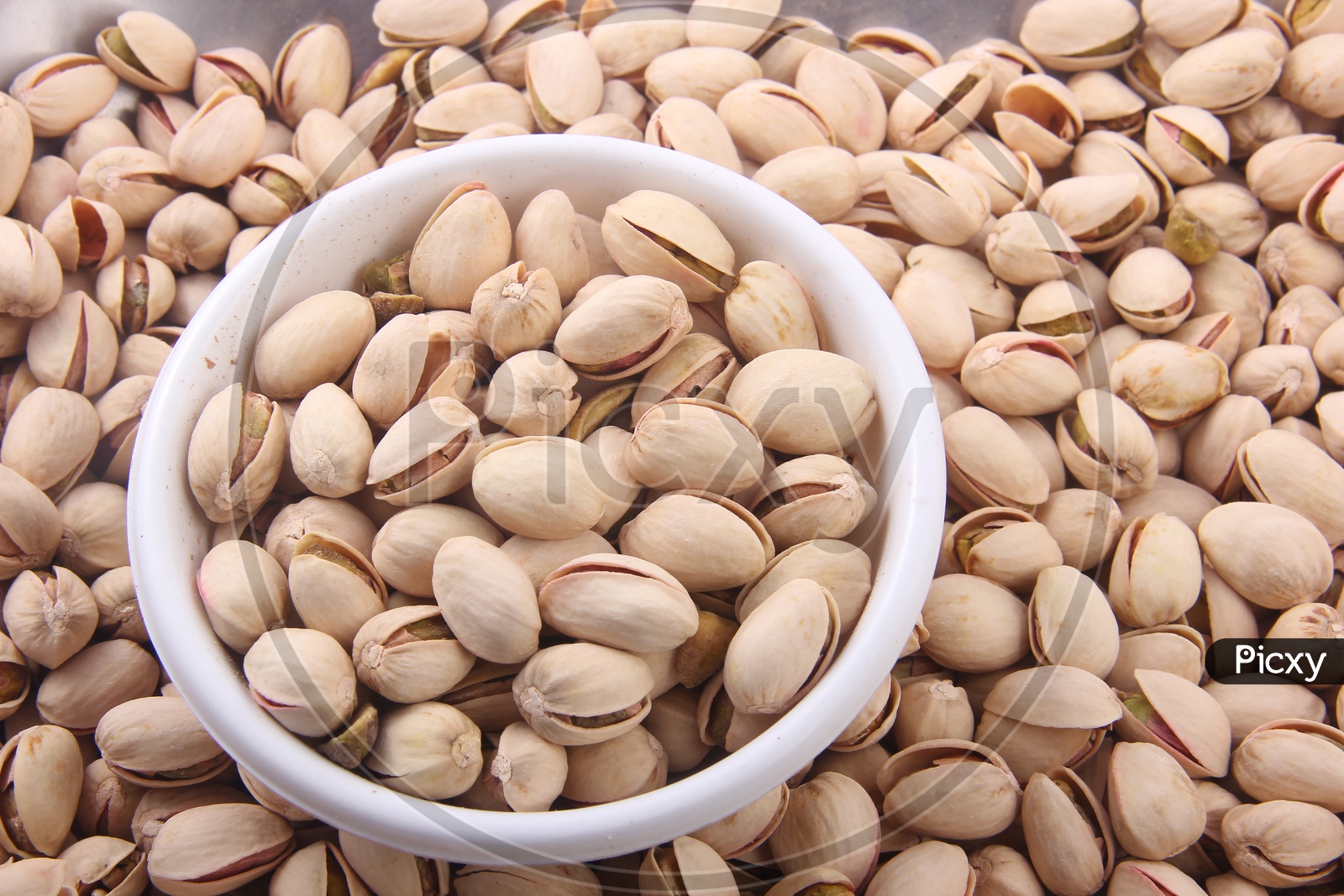 Pistachio Nuts In Bowl Showing The Texture