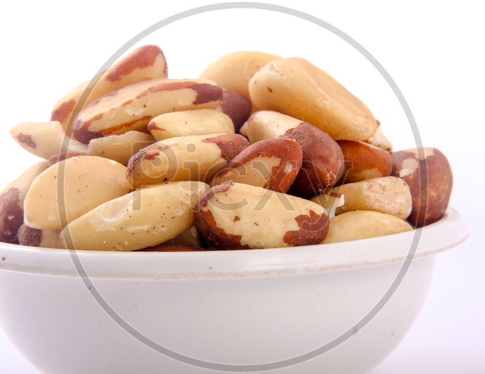 Peeled Almonds In a Bowl On an Isolated White Background