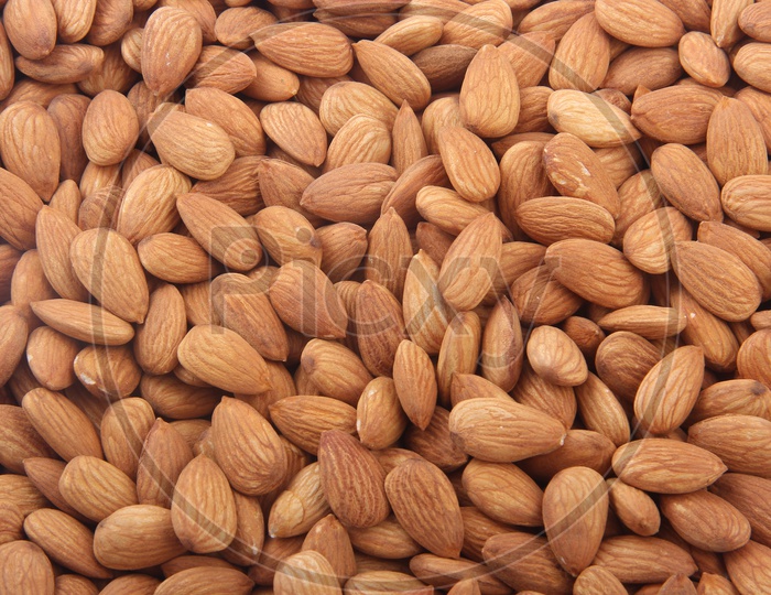 Background of a Big Raw Almonds Situated Arbitrarily