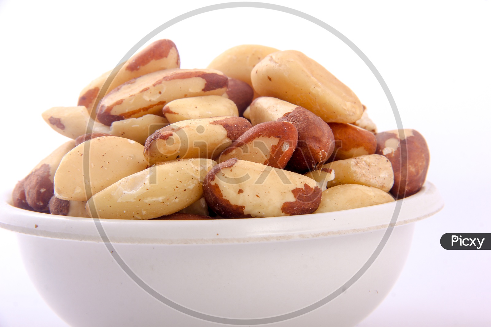 Peeled Almonds In a Bowl On an Isolated White Background