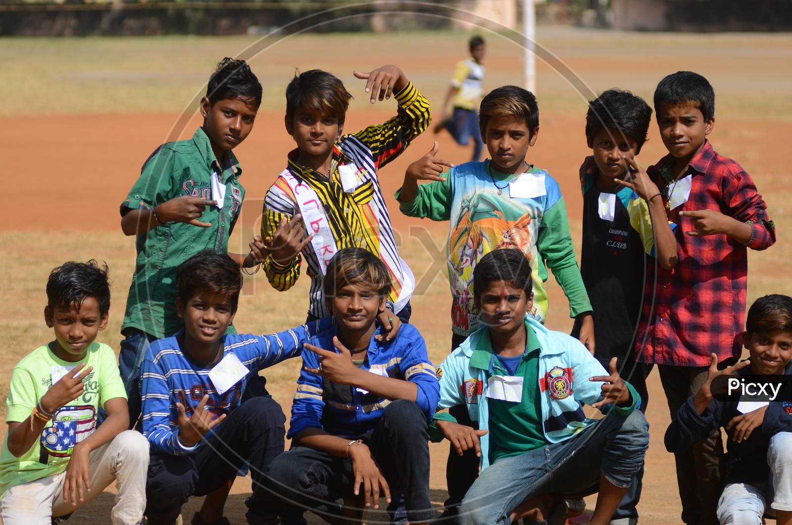 Children pose for a photograph during National Child Labour Project program.