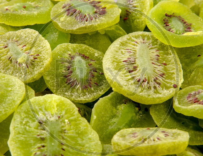 Dried Kiwis Composition Shot Forming a Background