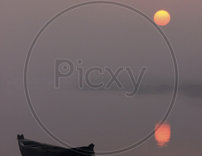 Beautiful Sunrise and Boat in Lake / Beautiful Sunrise and Reflections Early in foggy Morning