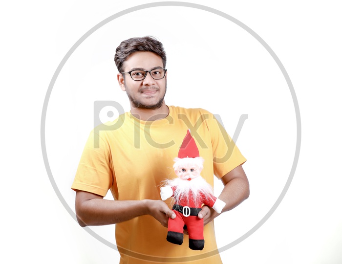 Young Indian Man with Santa Claus and white background.