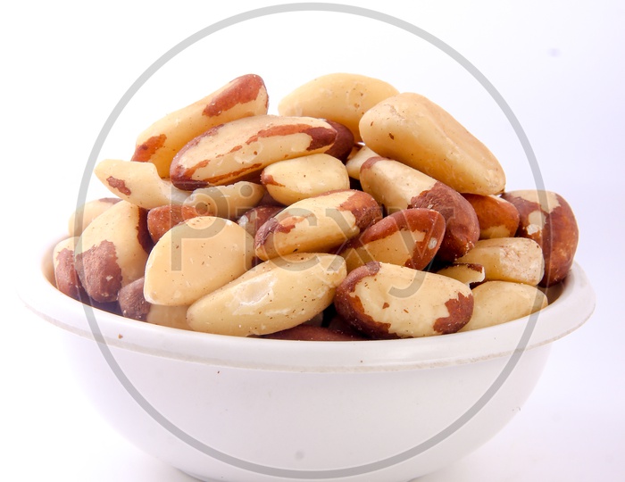 Roasted Peanuts In a Bowl On an Isolated White Background