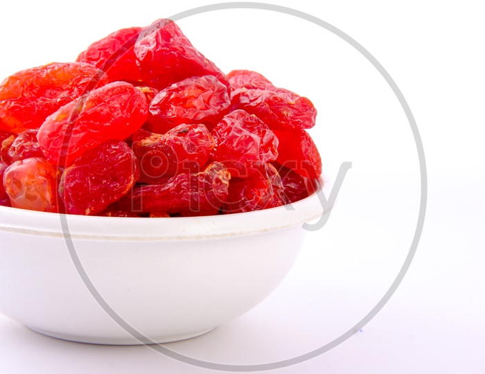 Dry Red Berries in a Bowl On an Isolated White Background