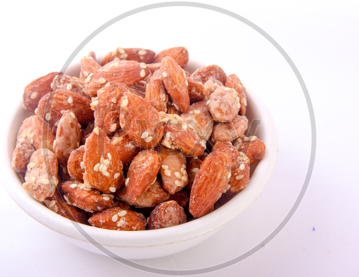 Sugar Sesame Almonds  in Bowl Isolated in White Background