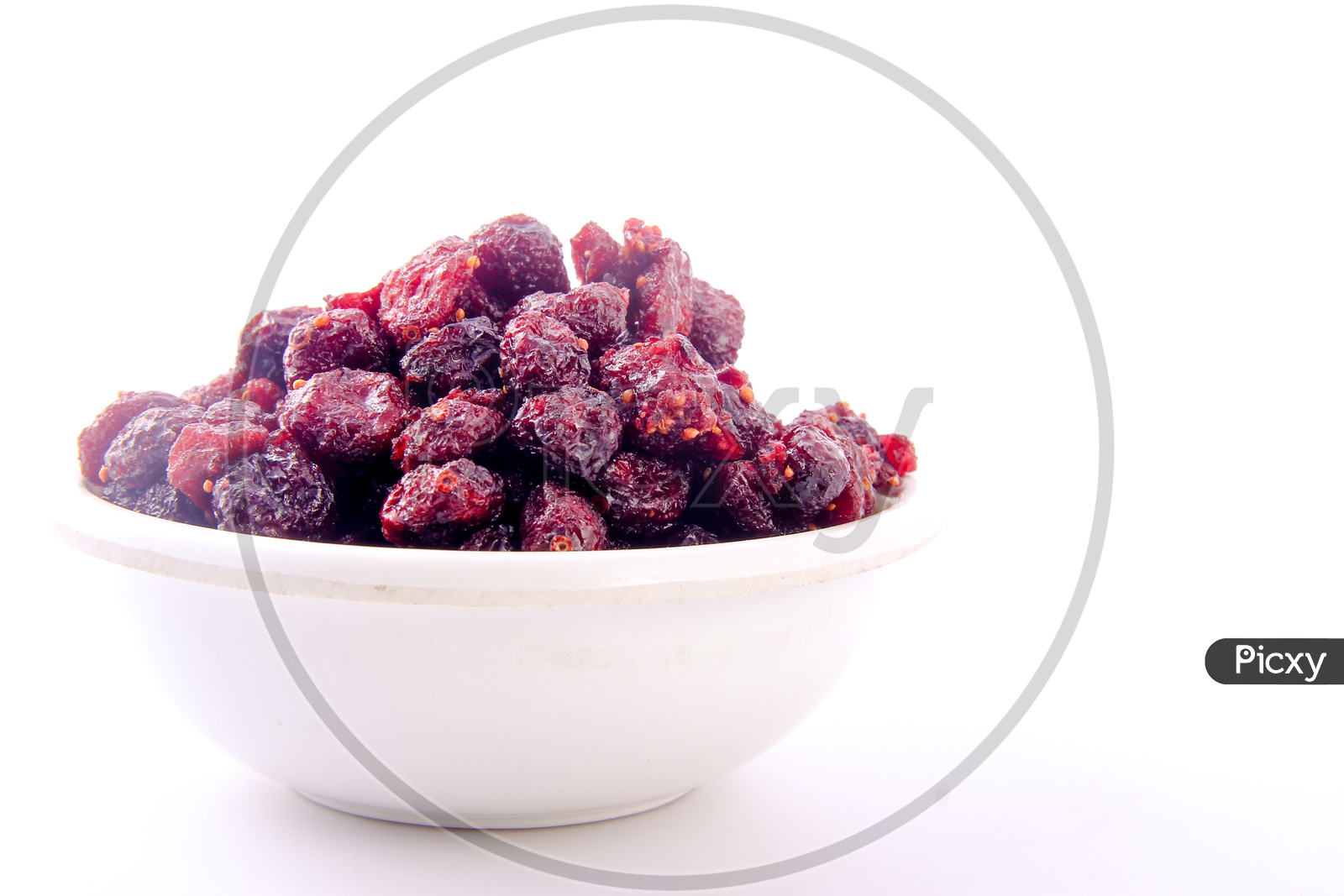 Dried Red berries In a Bowl On an Isolated White Background