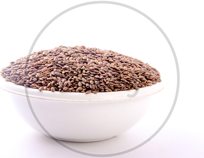 Flax Seeds in a Bowl On an Isolated White Background