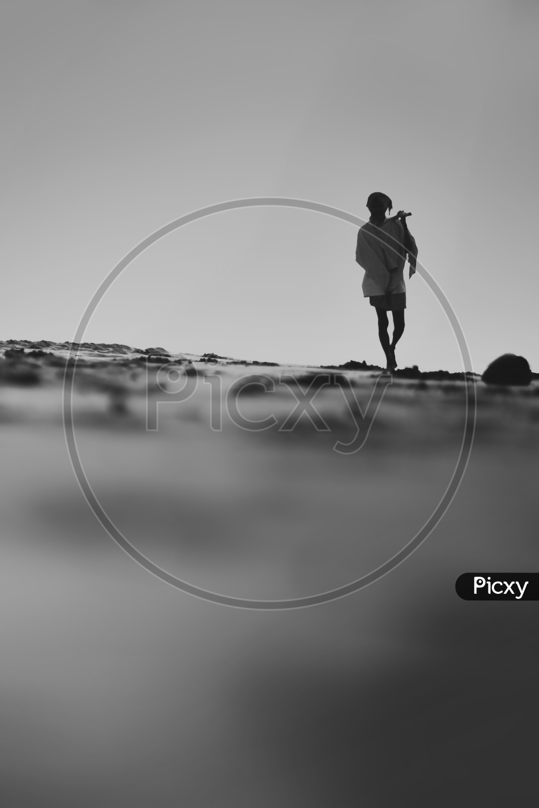 An Old Man Walking Alone On Onshore Beach / Man Walking Alone on Bay