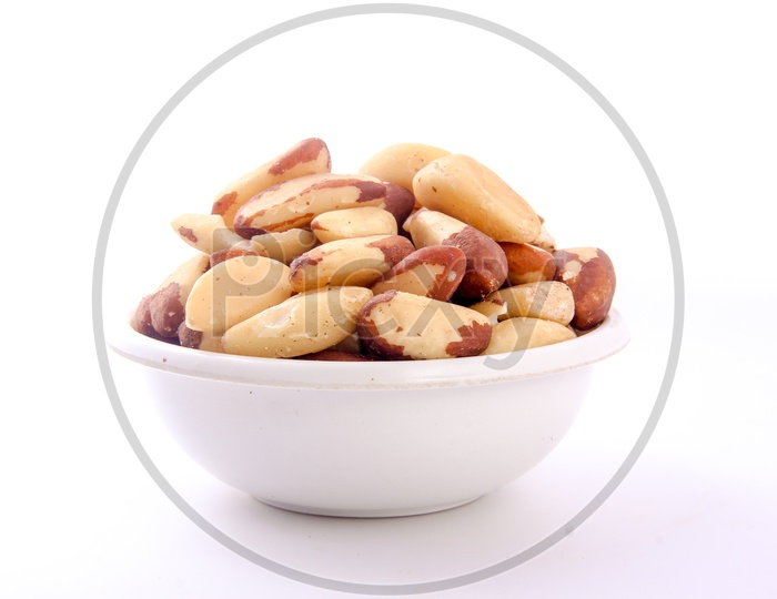 Roasted Peanuts In a Bowl On an Isolated White Background